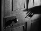 Number Seventeen (1932)door handle, hands and shadow